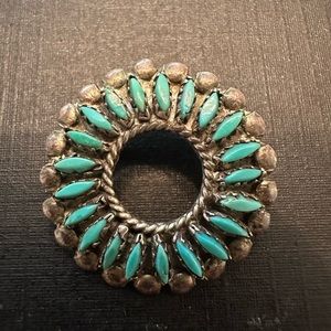Small sterling and turquoise signed Zuni pin .